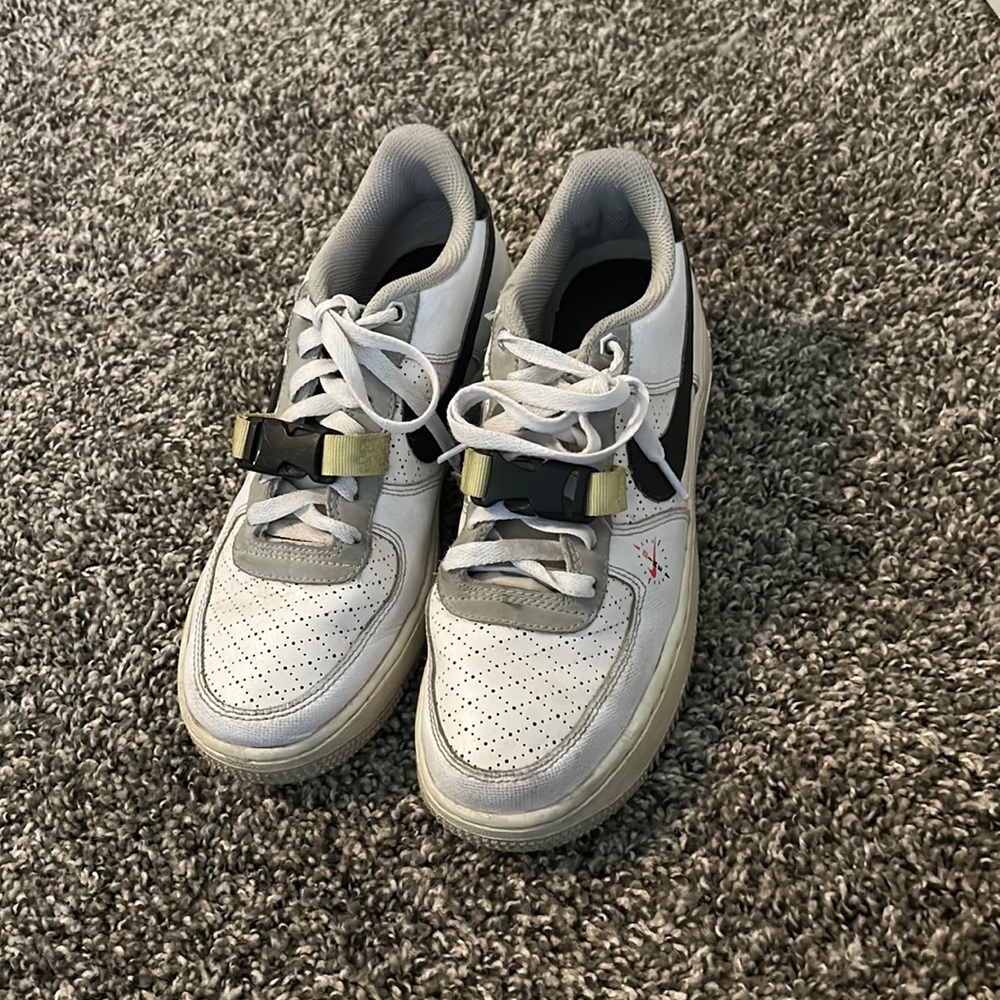 White and black Nikes with a hint of lime green